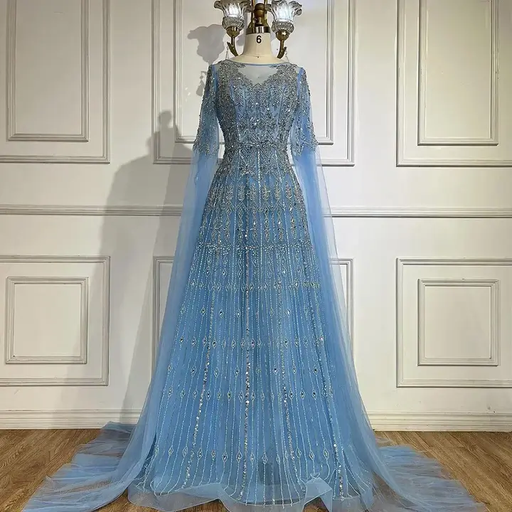 Best Party Wear Dresses Kottakkal. Elegant sky blue beaded evening gown with cape sleeves and intricate embroidery,